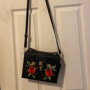 Aldo Black Crossbody Bag with Red Floral Design
